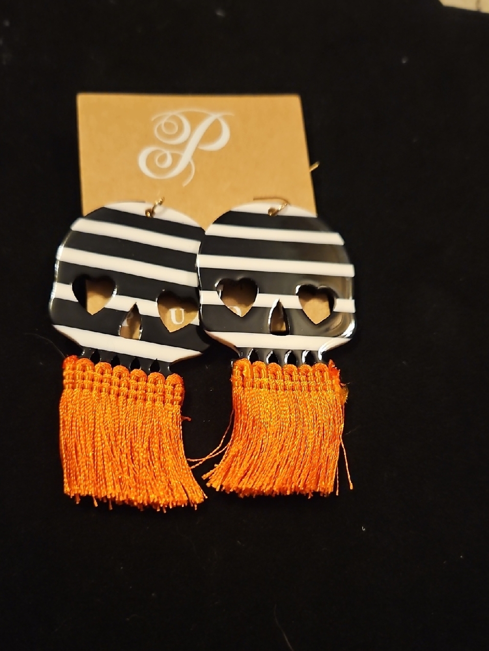 Plunder Black & White Striped Skull Earrings with Orange Fringe